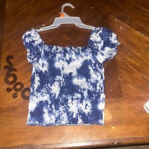 this cute blue shirt is for girls and  it’s a size Medium.